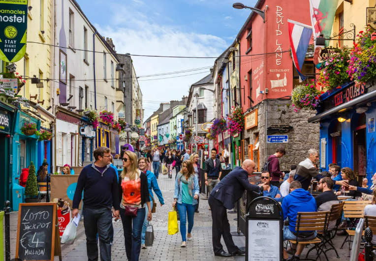 Street musicians on a colourful street in Galway's Latin Quarter